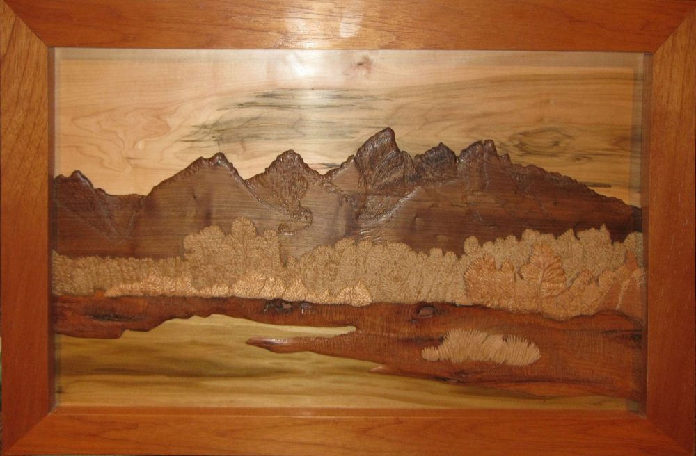 Grand Teton mountain range in layered hardwood relief sculpted by Francis 